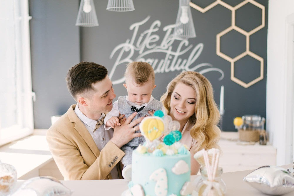 family celebrating first birthday party